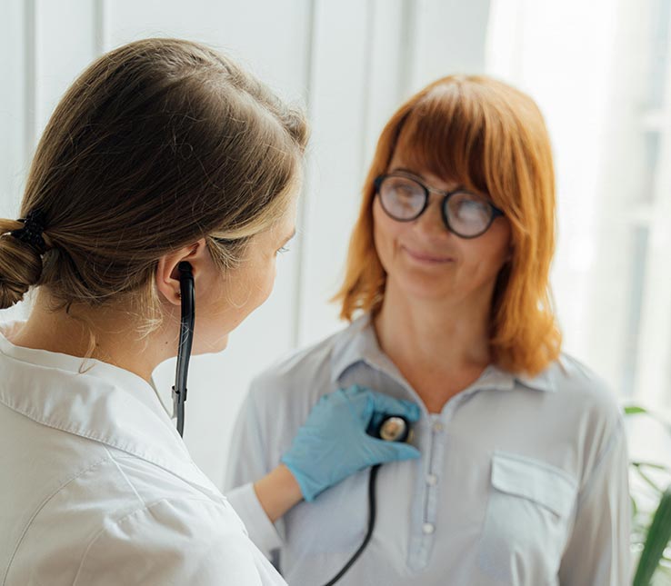 Doctor examines Gen Z patient in modern office