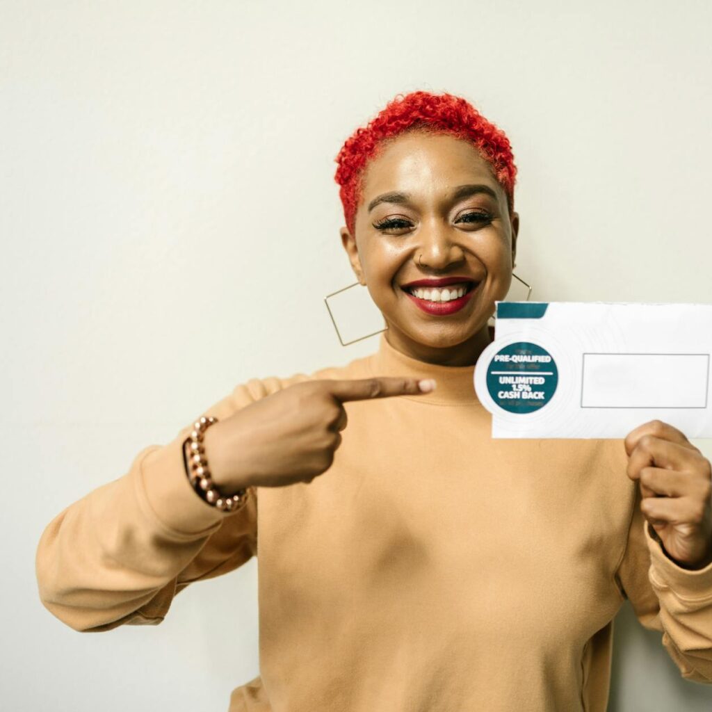 a woman holding an envelope