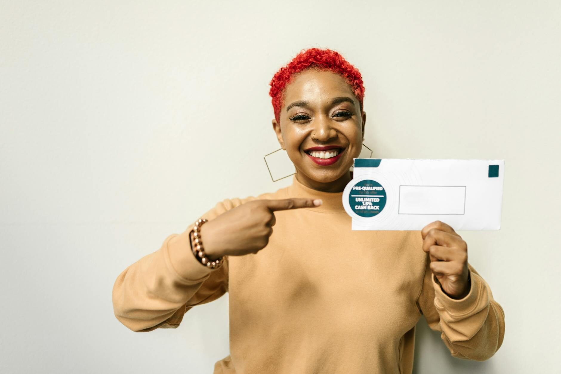 a woman holding an envelope