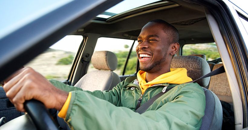 Man get auto loan and is driving away happy.
