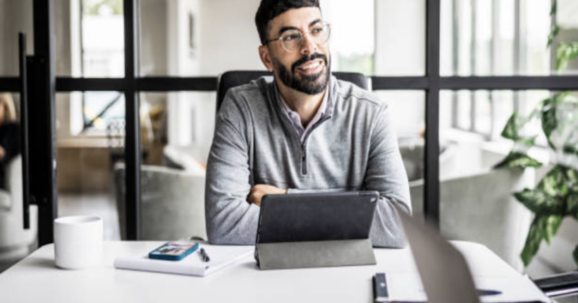 A man feels happy because he knows his assets are being managed.