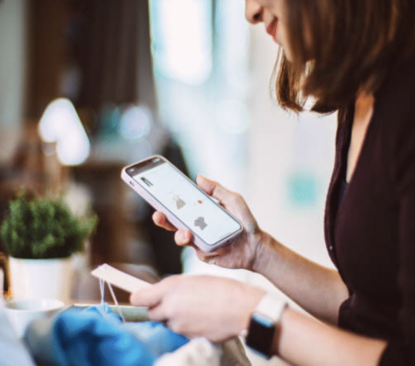 Person analyzing Buy Now Pay Later payment options on smartphone.