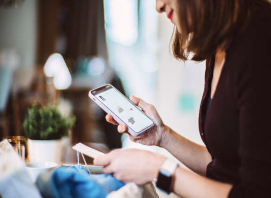 Person analyzing Buy Now Pay Later payment options on smartphone.