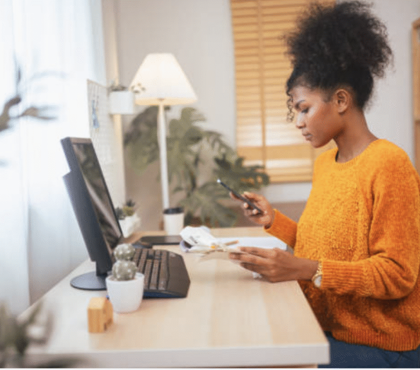 Woman using computer to aid in money management.