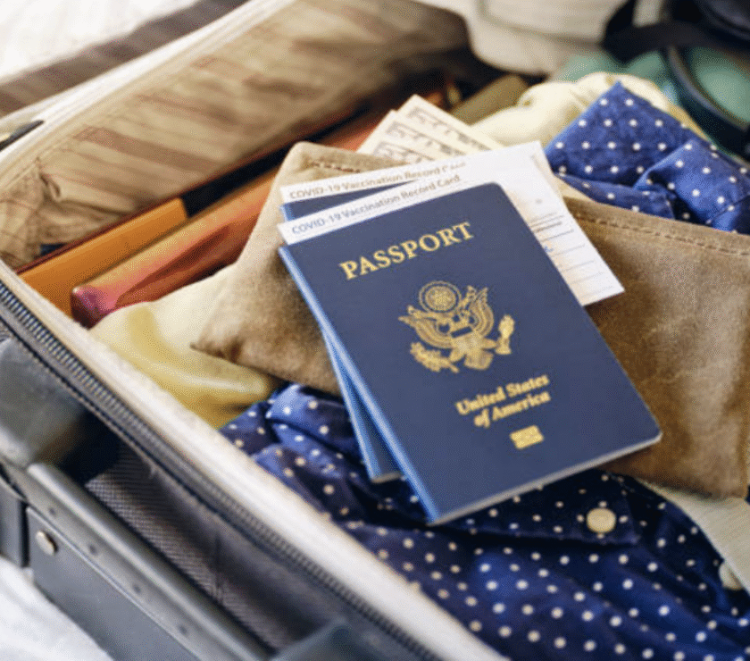 Travel passport displayed inside suitcase.