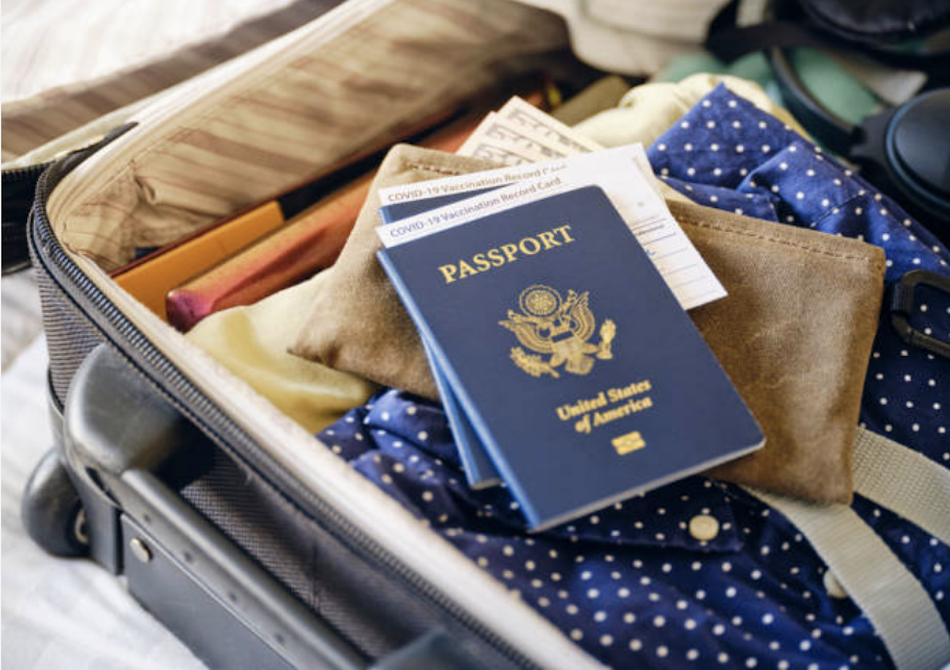 Travel passport displayed inside suitcase.