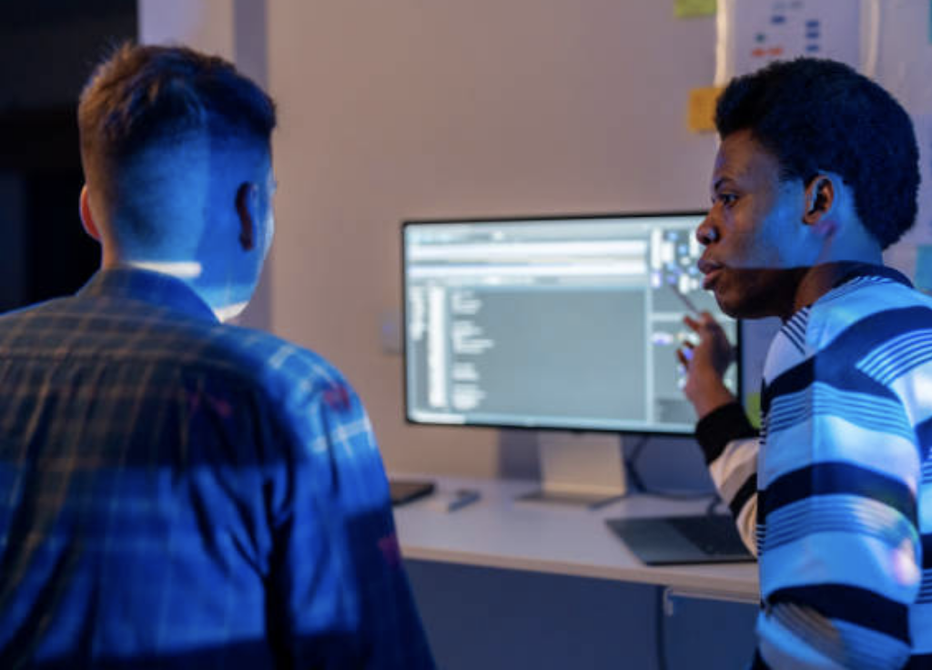 Two database administrators engaging in project management.