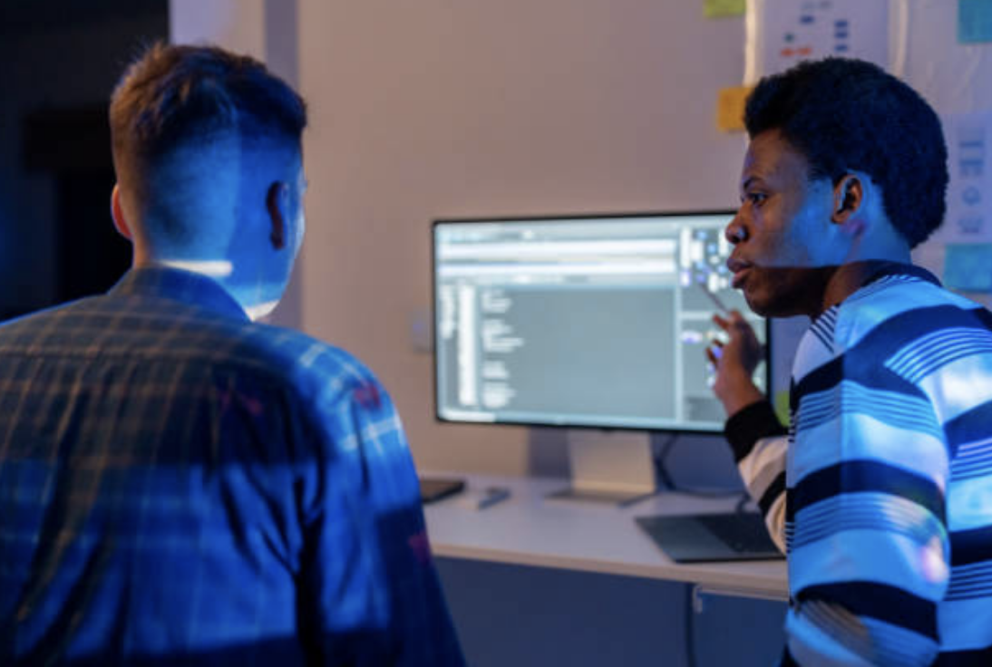 Two database administrators engaging in project management.