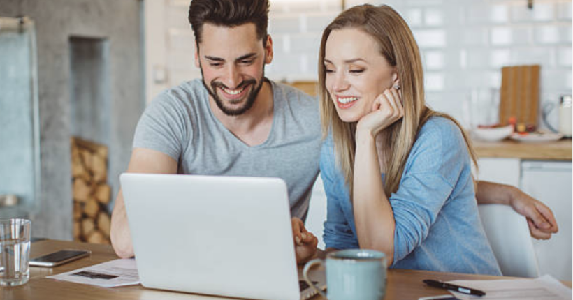 Two professionals working remotely are collaborating on advanced technologies like generative AI, blockchain, and cloud computing, reflecting the rise of minimum wages and tech-driven skills.