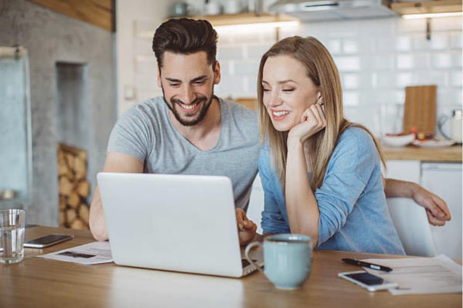 Two professionals working remotely are collaborating on advanced technologies like generative AI, blockchain, and cloud computing, reflecting the rise of minimum wages and tech-driven skills.