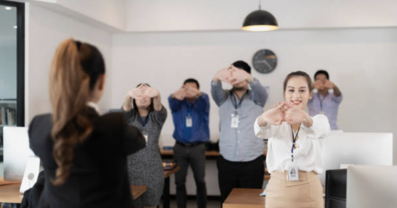 Financial professionals practicing mindfulness in a corporate setting.