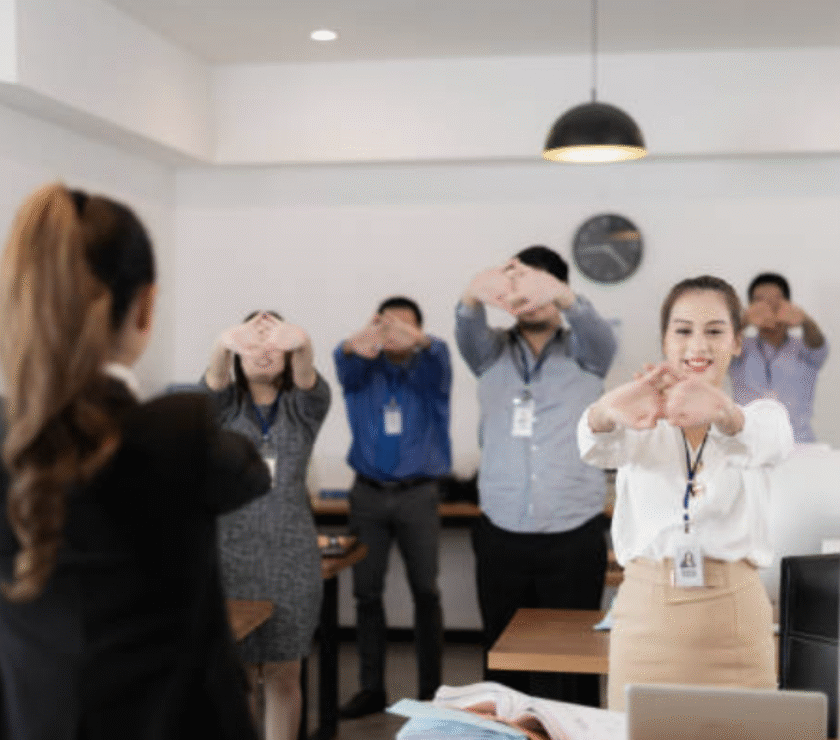 Financial professionals practicing mindfulness in a corporate setting.